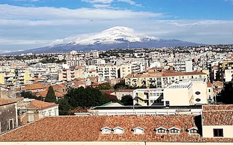 Catania with snow-capped Mount Etna