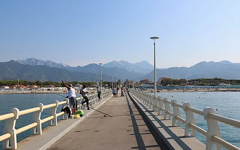The pier of Forte dei Marmi and the Apuan Alps