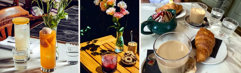 Dalla colazione all'aperitivo da Biffi: due drink in bicchiere alto, un drink rosso con ghiaccio su un tavolo di legno al sole, cappuccino e croissant